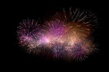 Beautiful colorful fireworks display lights up the sky with dazzling display during New Year...