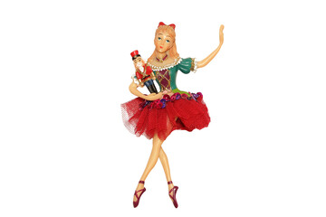 figurine of a ballerina with a nutcracker in her hands isolated on a white background