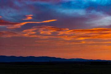 Sunset sky with multicolor clouds. Gorgeous panorama twilight sky and cloud at morning background. Dramatic beautiful sunset sunrise and dramatic clouds. Panorama sunset sky for background or sunrise