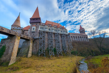 Fototapeta na wymiar The Corvin or Hunyadi castle (Castelul Corvinilor or Huniazilor) is a Gothic-Renaissance castle with wooden bridge in Transylvania, Romania, one of the largest in Europe. Traveling concept background