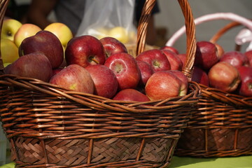 A huge number of fresh apples of different varieties on a big sale