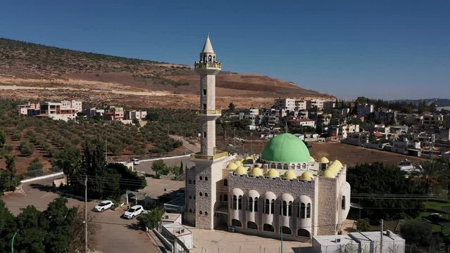 Aerial camera footage of a mosque and surrounding city in Jerusalem, Israel