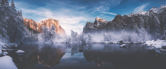 Valley view at Yosemite national park in California during winter season with snows and ice dramatic sunset colorful sky