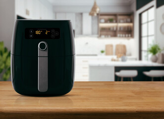 Air fryer machine cooking potato fried in kitchen. Lifestyle of new normal cooking..