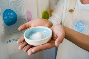 hands with a pile of salt,  Salobrar de Campos, Campos del Puerto,Mallorca, balearic islands, spain, europe