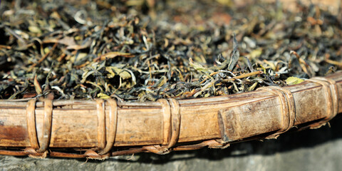  Tea leaves drying in a wicker basket