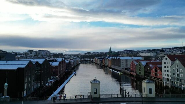 Drone footage from Trondheim. Flying up Nidelven river towards Trondheim Cathedral Domkirken. Filmed in January. Winter footage