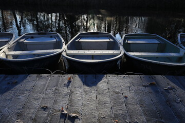 Three moored boats on a cold autumn morning
