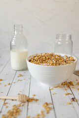 Close up granola milk and bowl with honey