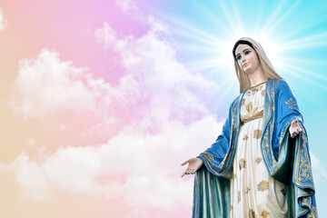 Statue of Our lady of grace virgin Mary with beautiful Sky Pastel with abstract colored background...