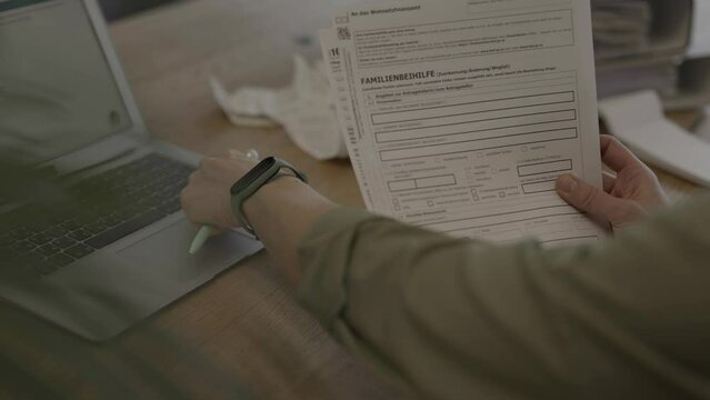 Family allowance form in German language in the hands of a female