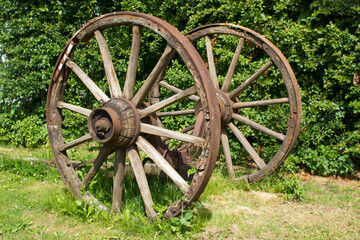 Fototapeta na wymiar Rural wagon wheels in a garden