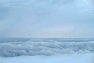Fototapeta premium Cloudy sky with more cloud and very small plane compose on skyline
