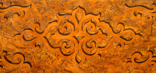 Carved wooden patterns of Asia. National traditional decoration of yurt furniture in ornament vintage weaving patterns, decoration of yurt wooden frame with patterns as ethnicity. Yurt doors.