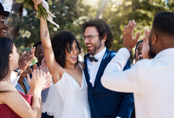 Happy bride and groom celebrate wedding with excited and cheerful applause in crowd of guests. Interracial love and happiness of couple at marriage event together with clapping and smile.