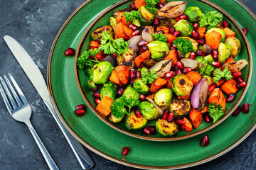 Vegetable appetizing salad on green plate