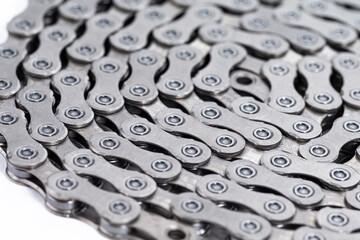 Extreme Closeup Of New Clean Oiled Twisted Circled Bicycle Chain Image Texture Isolated Over White