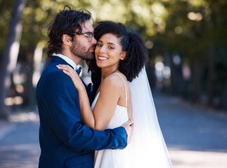 Interracial wedding and couple kiss portrait at romantic outdoor marriage event celebration...