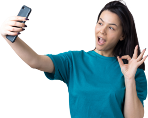 Portrait of a pretty girl taking a selfie isolated over grey background