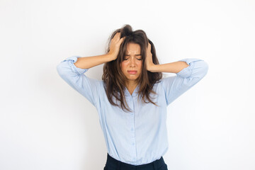 Naklejka premium Portrait of a Woman Feeling Stressed and Overwhelmed with a Headache