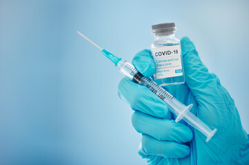 Doctor, hands and covid vaccine for cure, healthcare or medical syringe medication to combat the...