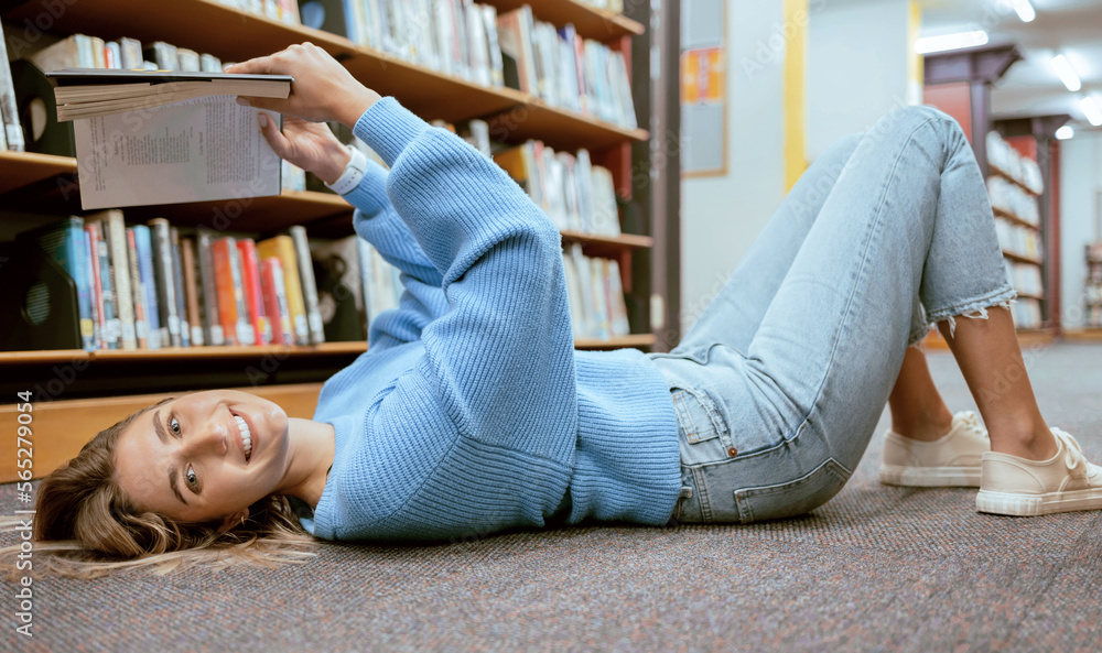 Canvas Prints Portrait, woman on floor and reading in library, relax and learning with smile, hobby or higher education. Female student girl or lady with book, knowledge or college research for studying and campus