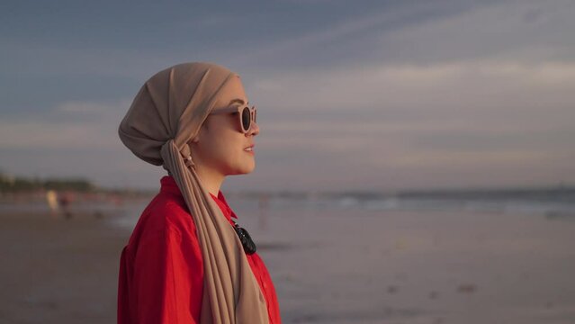 Modern Indonesian Muslim Woman on Hijab - Portrait, Smiling, looking to The Sunset. Optimistic Hopefull