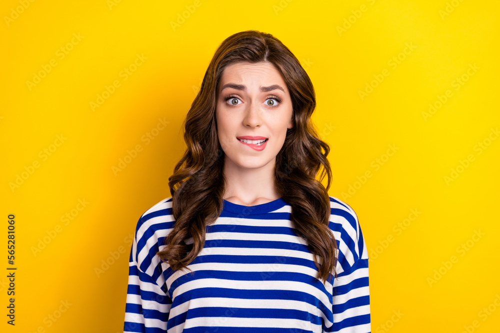 Sticker Photo of young nervous woman bite lip oops forgot turn off electronics home stress stunned problems dissatisfied isolated on yellow color background