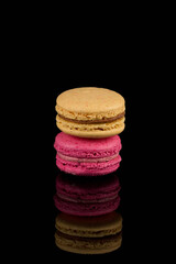Colorful macaroon over black background
