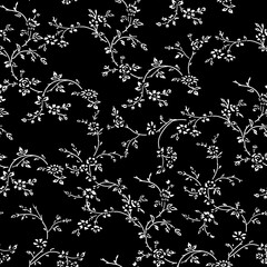 Hand drawn ornamental small ditsy floral doodle seamless pattern background