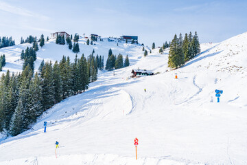 Wintry landscape on Hahnenkamm mountain in Austrian Alps in Kitzbuhel. Winter in Austria - obrazy, fototapety, plakaty