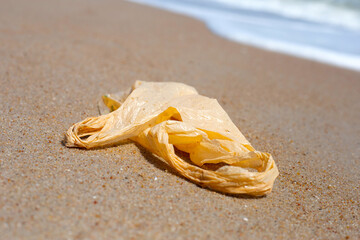 Plastic bag pollution on the beach