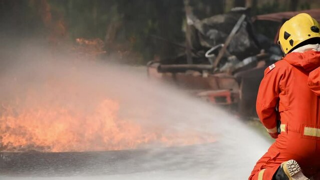 firefighter training new fireman team. Fire fighter learning car accident in fire under emergency case. rescue service of Emergency Care System of Insurance team.	
