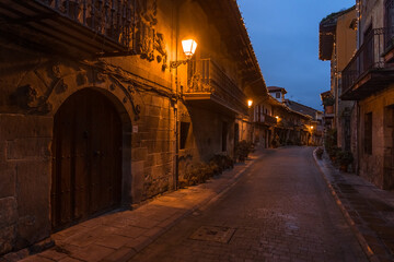 Beautiful village of Cartes illuminated at night, in Cantabria, Spain.