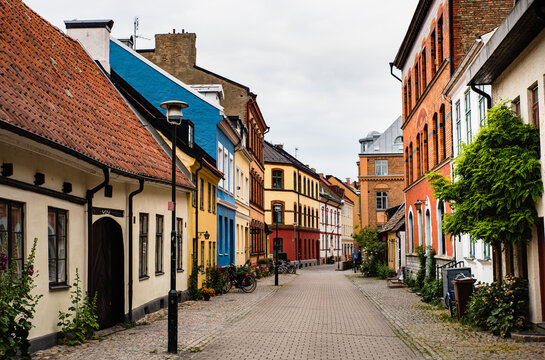 Historical alley with typical Swedish houses in Malmo Gamla Stan, Malm&ouml; old town. Swedish cobbled alleyway with bicycles shows the Nordic architecture