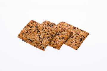 Cookies with seeds, sesame and flax. Vegan product. From organic products, on a white isolated background. Close-up.