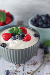 A bowl with Greek yogurt with berries