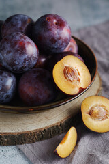 A bowl with ripe plums