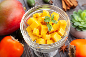 sliced mango on wood background