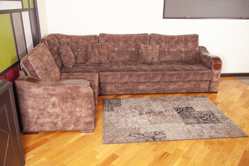 Modern living room with comfortable brown sofa.