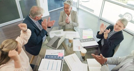 Success, applause and celebration of business people in office for goals, achievements or targets. Top view, teamwork and group collaboration of employees clapping and celebrating victory or winning