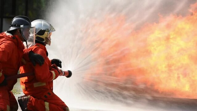 firefighter training new fireman team. Fire fighter learning stop fire burn under emergency case at fire station. rescue service of Emergency Care System of Insurance team.