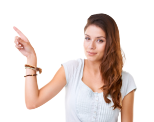 Portrait of a gorgeous young woman pointing at copyspace Isolated on a PNG background.