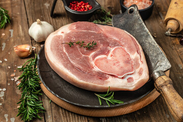 raw ham hock on a wooden background, Culinary cooking. banner, menu, recipe top view