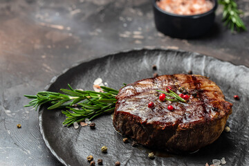 steak roasted on the grill on a dark background. Healthy food concept. place for text, top view