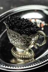 sturgeon caviar sturgeon caviar on a metal tray, Restaurant menu, dieting, cookbook recipe vertical...