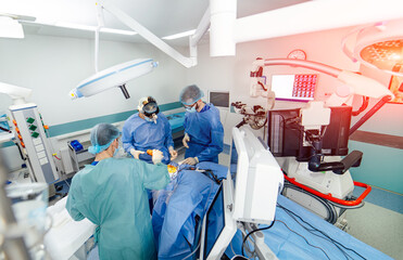 Team surgeon at work in operating room. Modern equipment in operating room. Medical devices for neurosurgery.