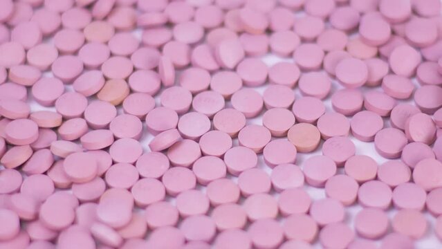 production of tablets conveyor. Pills Purple color close-up