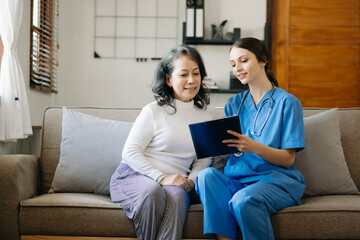 Asian female hands touching old female hand Helping hands take care of the elderly concept in  hospital.