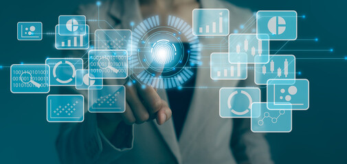 Business and Technology. Businesswoman touching on blue icon. Blurred background.
